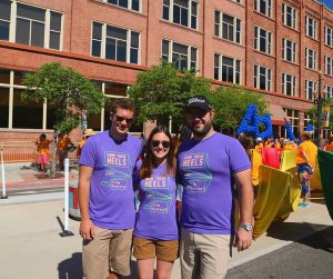 Carly Nelson pictured in the middle of her brother (L) and boyfriend (R)